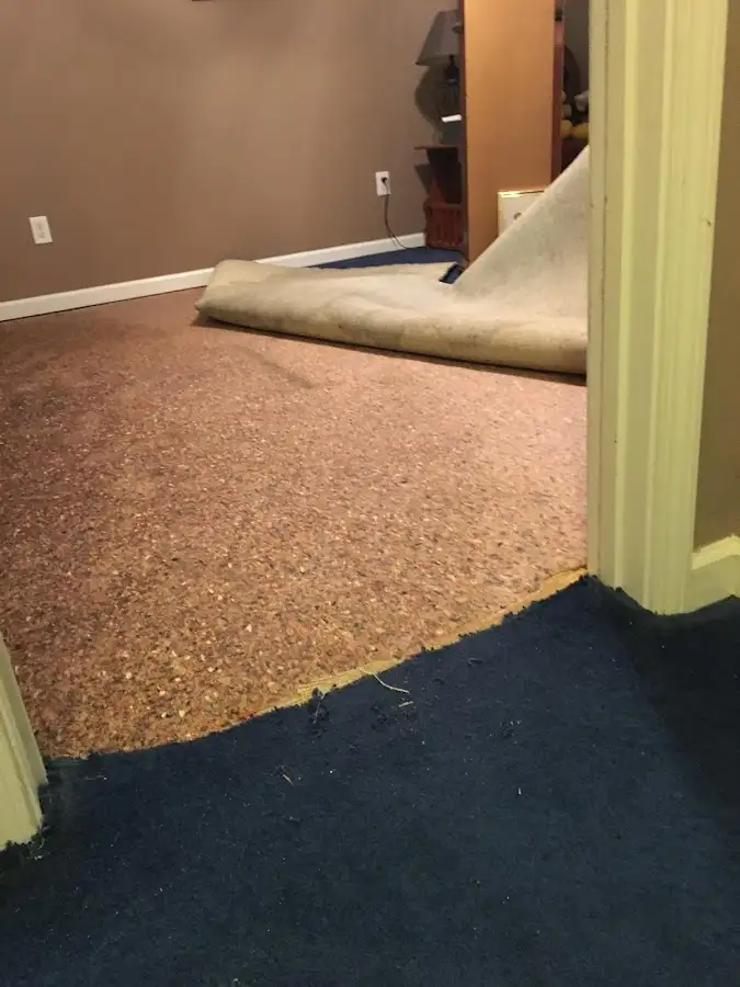Carpet pad removal revealing water damage during Drying & Dehumidification in Hayden